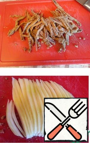 Boiled beef and onions cut into strips.