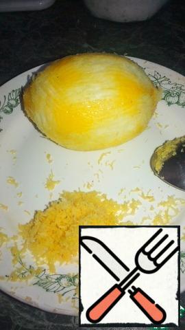 Using a grater, remove the lemon zest.