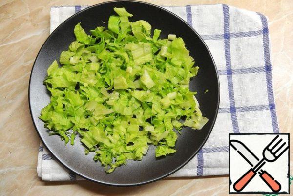 Lettuce to break it into very small pieces and place on a plate.