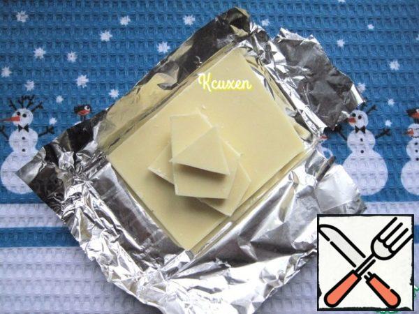 White tile (non-porous!!!) break the chocolate into pieces.
