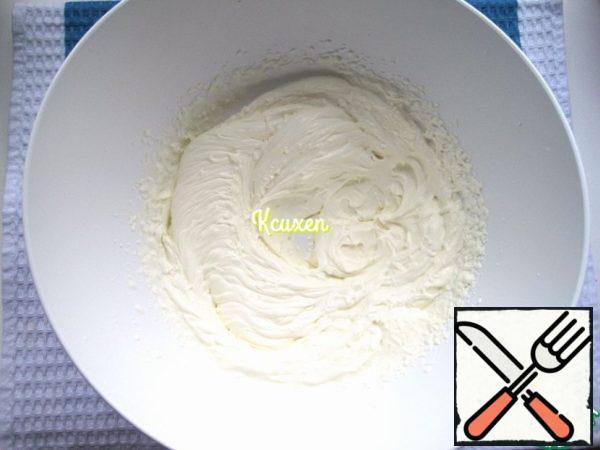 In a separate bowl, whisk the cooled cream to soft peaks. Continuing to beat, add mascarpone...
