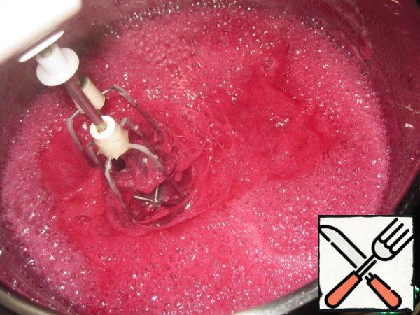 Start whipping immediately after removing from heat, add soaked and dissolved gelatin.
