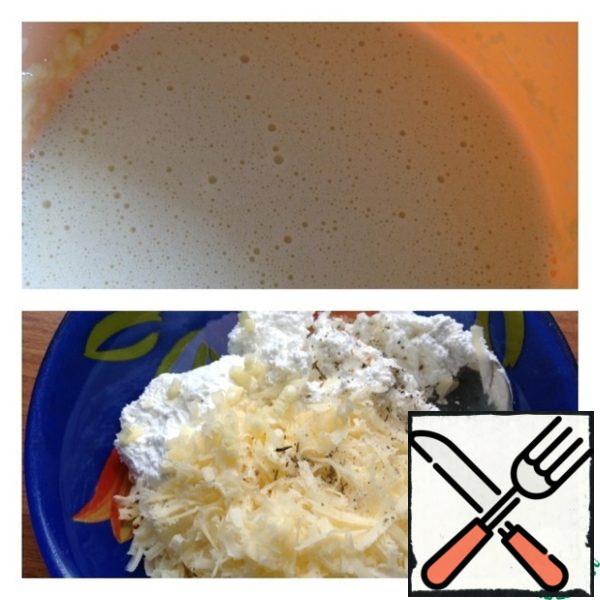 From the products indicated for pancakes knead the dough and bake pancakes, or use your pancake recipes, but they should not be sweet and thin.
Pour the curd into a Cup, grate the cheese on a medium grater and add a pinch of Svan or Adyghe salt, garlic clove passed through the press.