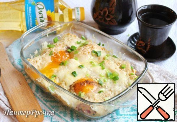 Bake in a preheated 220 degree oven 15-20 minutes before melting the cheese and setting the protein. The yolk should remain liquid. If desired, sprinkle with green onions.