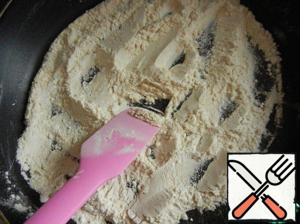 Fry the flour in a dry pan, stirring constantly, so as not to burn. Fry until the flour gets a nice creamy shade.