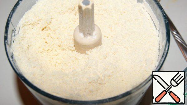 Place in a blender with flour mixture and punch to form crumbs.