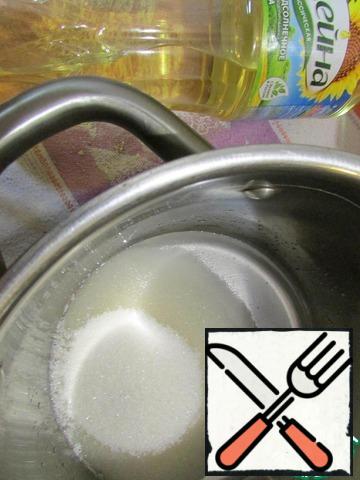 In a saucepan pour water, add sugar and put on a small fire. Bring to boil. Sugar should dissolve.