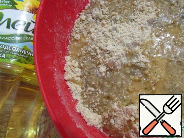 Pour the warm syrup into the nut-flour mixture. Mix thoroughly.
