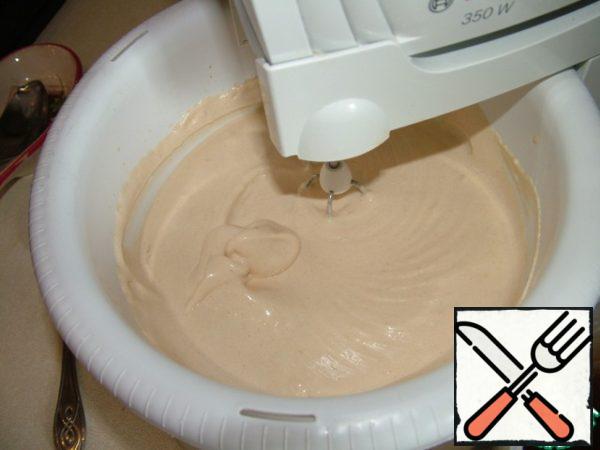 Beat for another 5-7 minutes, until the mass becomes very dense and retains its shape.
