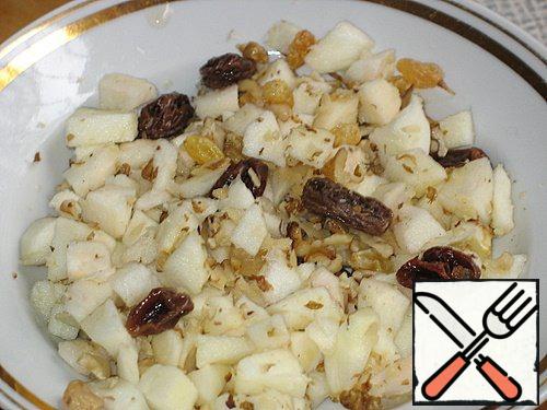 Add raisins (pre-steamed and peeled from the tails) and finely chopped nuts.