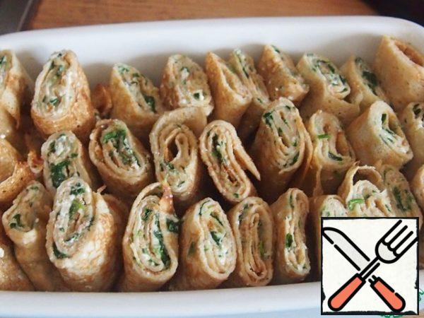 Place the pancakes in a baking dish, pressing them tightly together.
