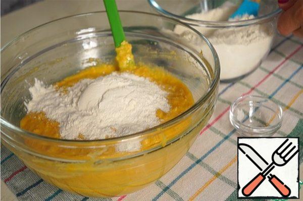 Add the halva, mix well. Mix flour with baking powder and add to dough.