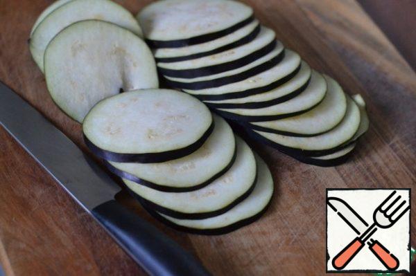 Cut eggplant into thin slices.