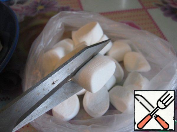 I have large marshmallows, so we cut them in half and put them in the freezer for about an hour.