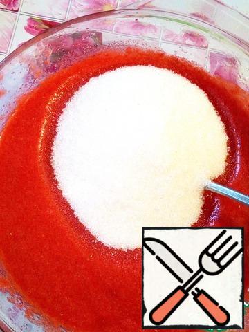 Strawberry puree warm up to a hot state (I do it in a microwave) and add 200 g of sugar.
Stir until sugar is completely dissolved.