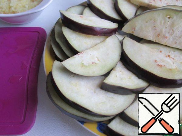 Pat the eggplant slices with a paper towel.
