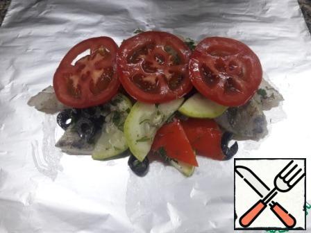 Spread a pile on a sheet of foil. Add tomato slices on top.