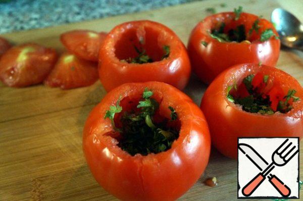 Put on the bottom of each tomato with coriander.