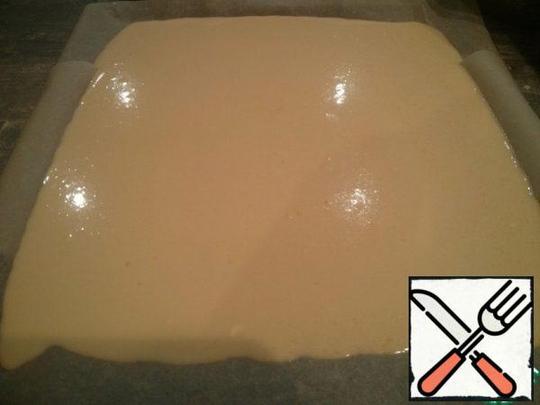 Sift the flour, add salt and baking powder, mix, gently add the liquid ingredients, stirring constantly so that there are no lumps. Pour the dough onto a baking sheet (my size is about 30x40) or into a large mold.
