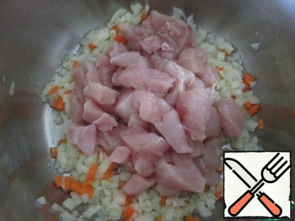 Then add the chicken cut into small pieces and fry for another 10 minutes, stirring.