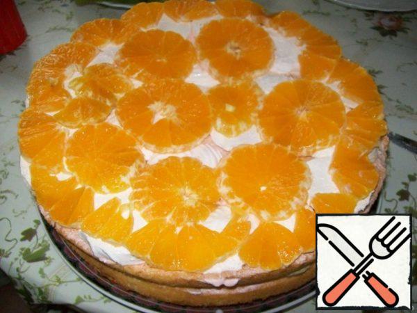 And again sponge cake, cream and mineola or orange. Smear the cake with cream and decorate with pieces of fruit.
Let the finished cake stand in the cold for at least 4 hours.