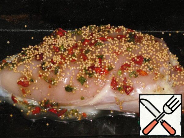 The breast is soaked in salt water for 2 hours (if the chicken breast is smaller, it can be kept for 1.5 hours, if it is very large, you can give injections with salt water)..The water should be salty, but not bitter. Stuff the meat with garlic. Make a paste from honey, butter (you can take the usual one), salt (a little), mustard, paprika and pepper.Lubricate the meat.Spread on a baking sheet.
