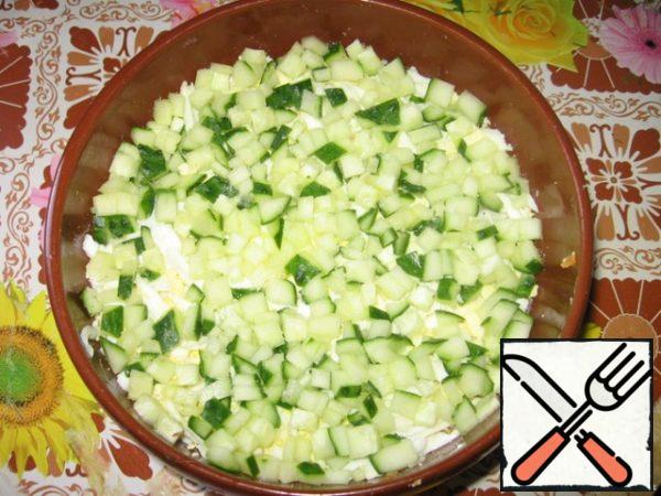 On top of diced fresh cucumber, cucumber, add salt.