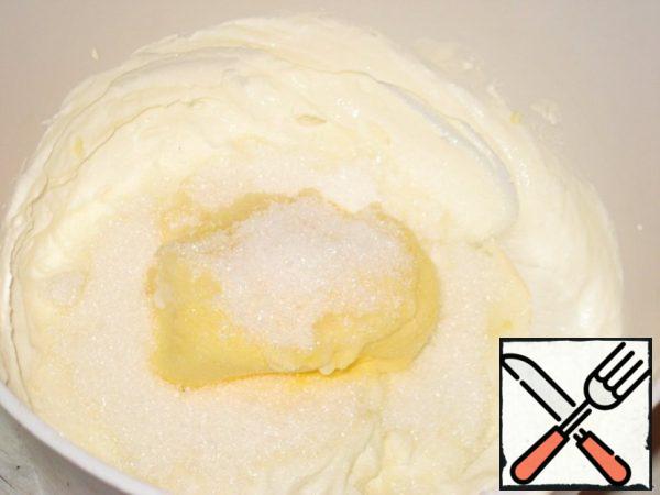 Then add the soft butter, sugar, vanillin, salt and beat with a mixer for 2-3 minutes.