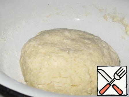 In a bowl pour the flour, add the grated butter, sour cream, sugar, soda and cold water. Knead dough. Refrigerate for 30 minutes.