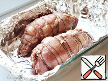 Before cooking, twist each breast into a roll, fasten with twine or toothpicks.
Cook in a heat-resistant open container, covered with foil (to be washed less)
