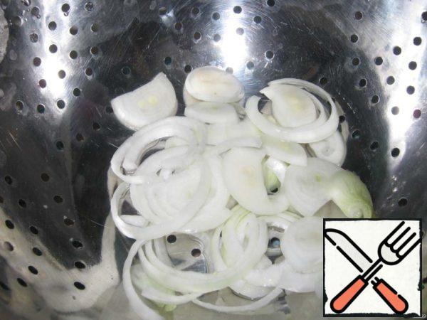 Scald onions with boiling water.