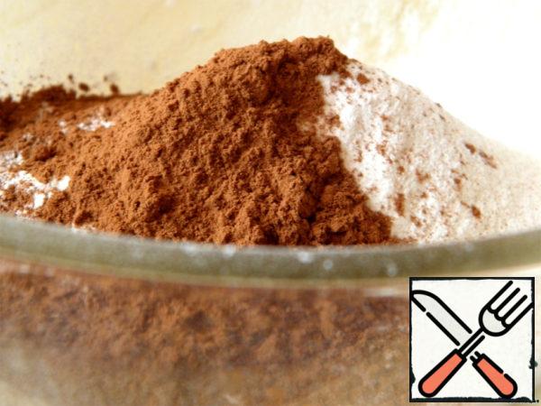 In a bowl, sift flour and baking powder, add salt and cocoa powder.
