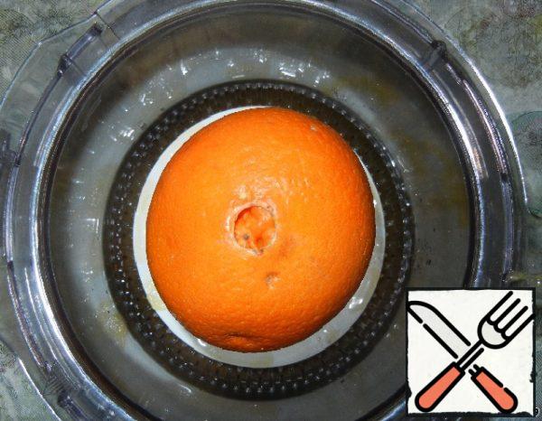 Squeeze the juice out of orange.