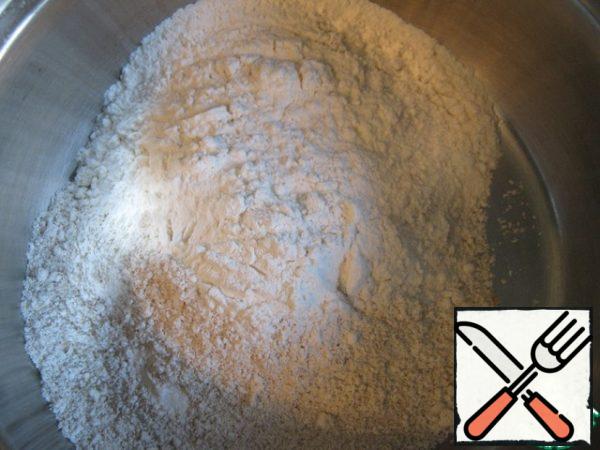 Mix oat flour with wheat flour and baking powder.