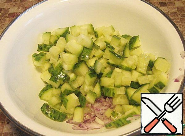 Cut cucumber medium dice, add to the onions.