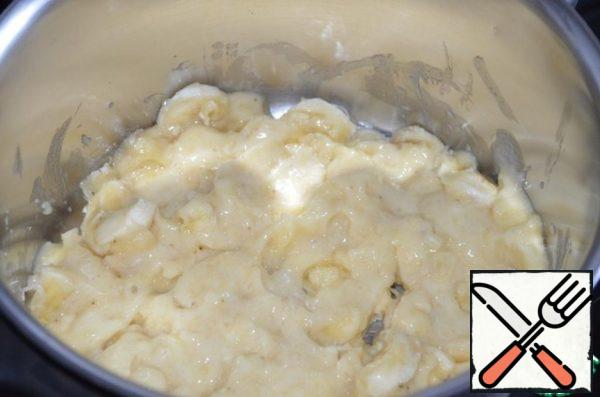 Put bananas in a saucepan and use a dip blender to grind them into a puree.