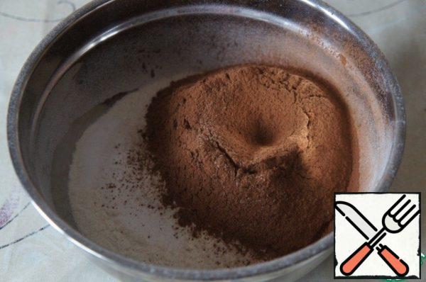 In a medium bowl, mix together the flour, cocoa powder, baking soda and salt, set aside.