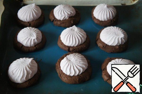 Return to the oven and continue baking until the marshmallows begin to melt, 2 to 3 minutes.
