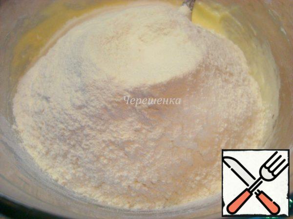 Add flour sifted with baking powder and mix again.