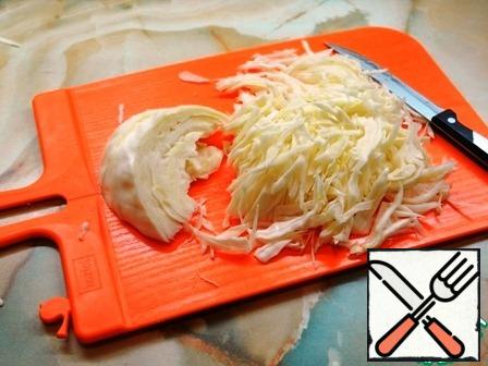 Chop the cabbage (if possible - a narrow straw).
Put it in a bowl, add a little salt and RUB with your hands.