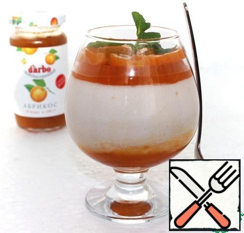Dessert pour apricot jelly and decorate with mint and slices of canned apricot.