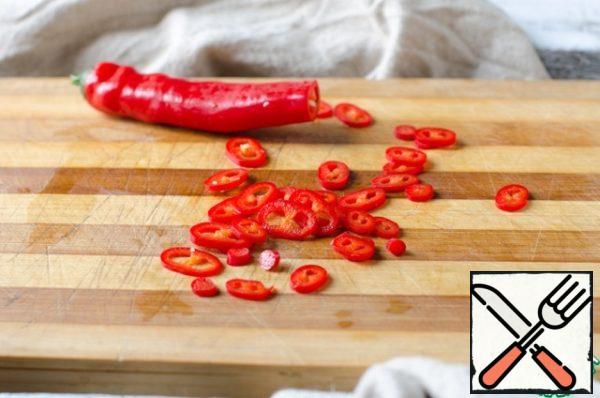 Red hot pepper cut into thin slices, freeing them from seeds. Peppers should be medium spicy.