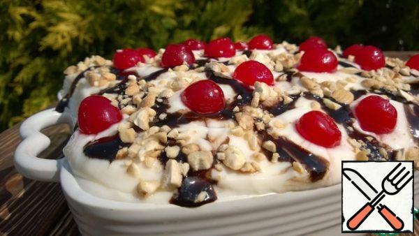 Decorate the dessert with cherries and nuts. You can pour over the chocolate.
This dessert can be prepared in portions, cups or cups. Bon appetit!