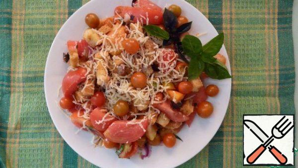 Mix all the ingredients of the salad. Garnish with grated cheese and basil sprigs on top.