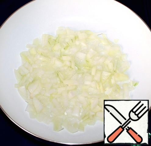 In a frying pan, pour vegetable oil and fry the onion until Golden brown.
