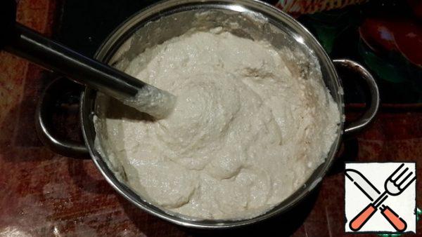 Add cottage cheese and yogurt. With a blender, turn everything into a homogeneous mass.