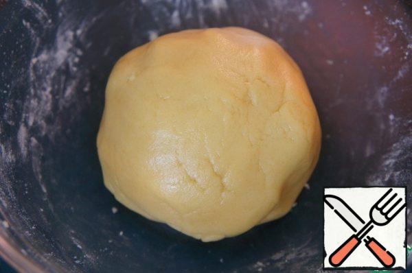 Knead the elastic dough. Wrap in a bag and put in the refrigerator.
