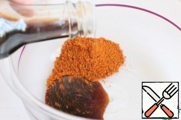 Mix soy sauce and spices. I have a mixture of paprika, basil, marjoram, salt and garlic. Be sure to add vegetable oil.
