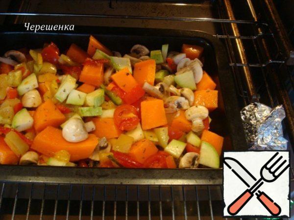 Bake vegetables, mushrooms and garlic in a preheated 200 degree oven for 20 minutes…
