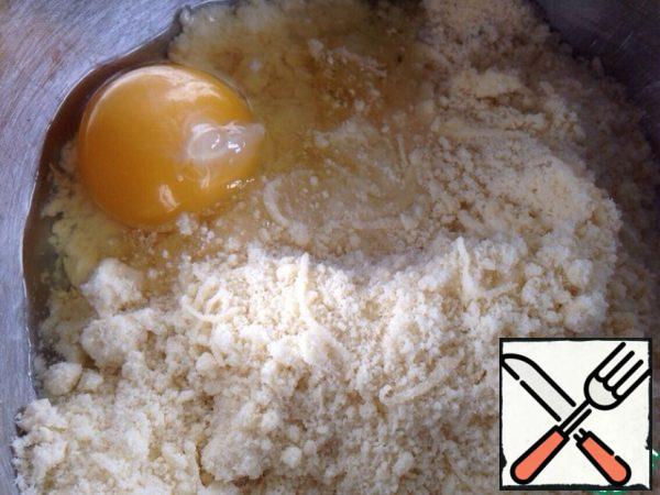 Add salt, grated cheese and rosemary. Beat the egg and knead the elastic dough. If necessary, you can add flour!